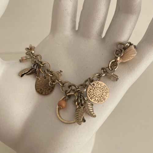 Accessorize bracelet with charms in pink and gold, like new