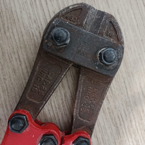 Bolt cutter with red handles and anti-slip grips