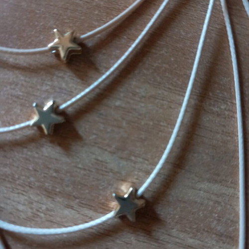 Star Necklace with Beige Cord and Multiple Layers Like New