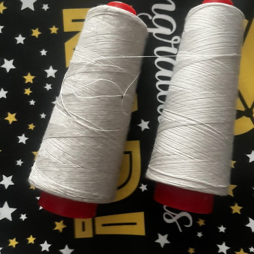 Sewing threads like new, three pieces, two ecru and one black
