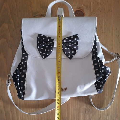 D. Raggi backpack with bow and polka dot details, like new