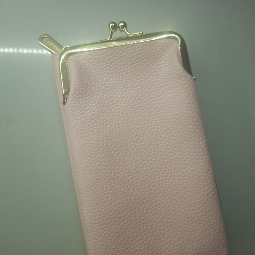 Pink wallet with strap and multiple compartments