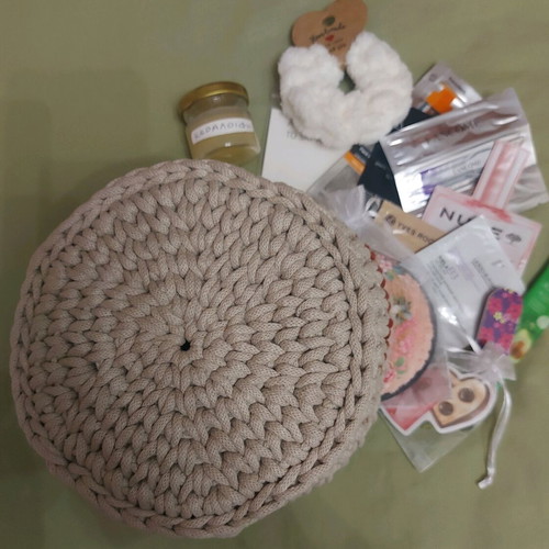 Knitted basket like new with gifts made of macrame cord