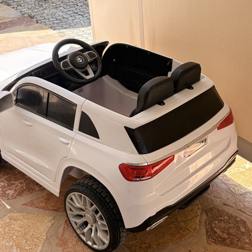 BMW Electric Ride-On Car like new with remote control and charger