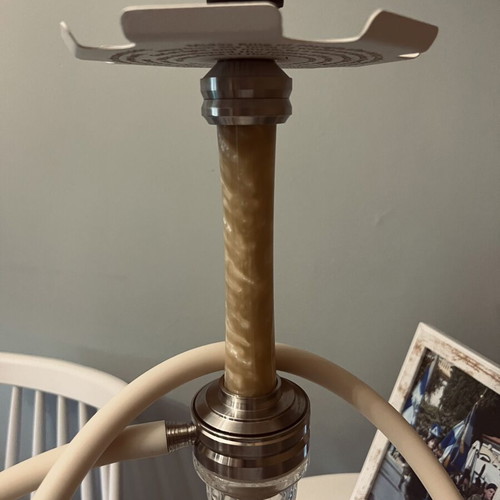 Hookah used with grill, tongs, coals, flavors, and cleaning set
