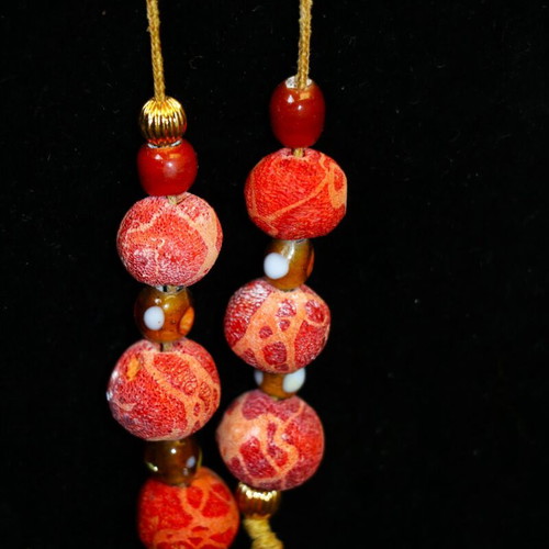 Begleri with genuine coral and 22K gold-plated beads, handmade by Indico Jewells