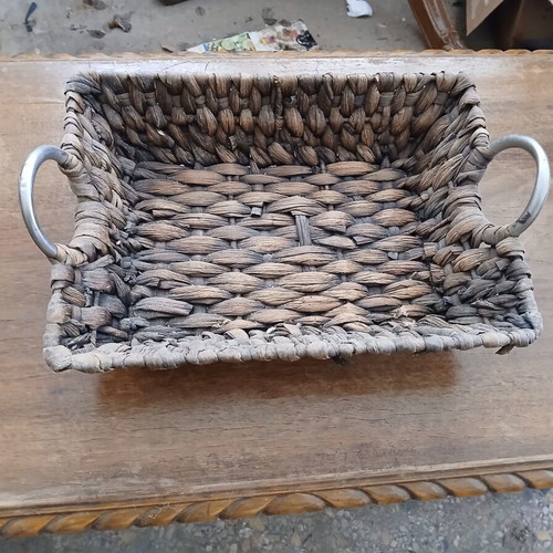 Woven decorative basket with metal handles like new