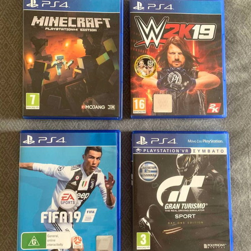 Sony PS4 500GB console with 2 controllers and 4 games