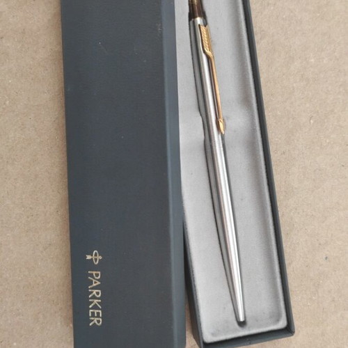 Parker pen used, silver with gold