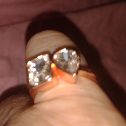 Rose gold ring with faceted rectangular and round stones