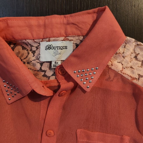 Sleeveless coral blouse with lace and studs, like new, size 6 years