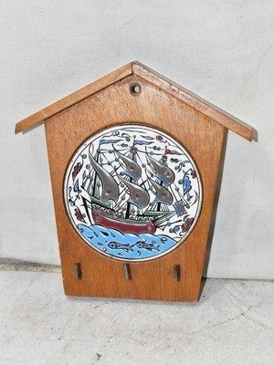 Vintage wooden wall key holder used with ceramic ship tile