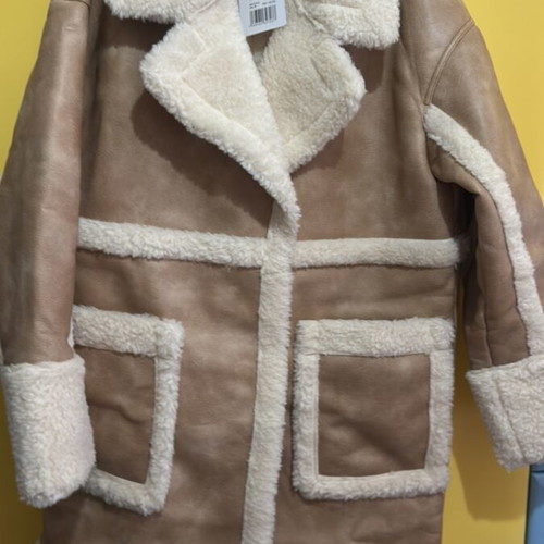Edited beige coat with fur lining, new with tags