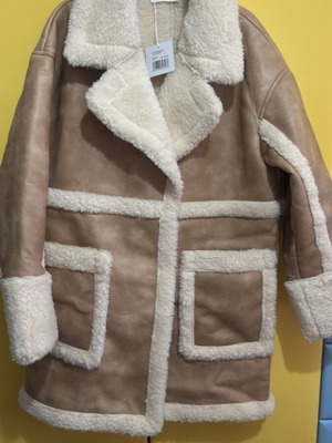 Edited beige coat with fur lining, new with tags
