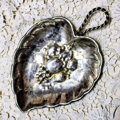 Vintage silver plated leaf-shaped plate used with embossed design