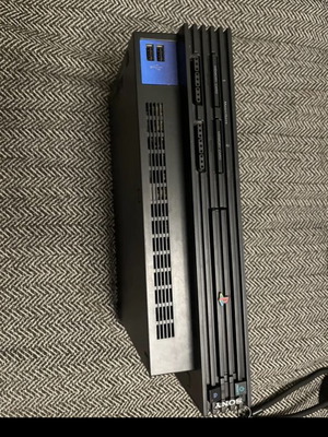 PlayStation 2 used with cables and functional