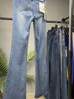 Light blue women's flared jeans with faded look