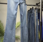 Light blue women's flared jeans with faded look