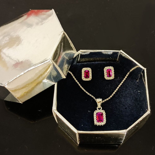 Silver jewelry set new with rosettes and pink zircon