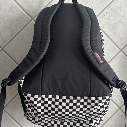 Jansport black and white checkerboard backpack with laptop compartment