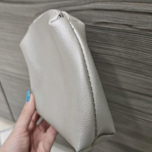 Small toiletry bags like new, gold and silver