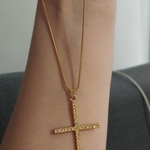 Gold-colored cross necklace with rhinestones