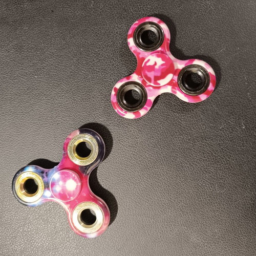 Fidget spinner set of 2 used with pink and purple designs