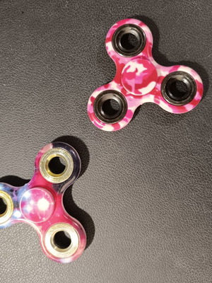 Fidget spinner set of 2 used with pink and purple designs