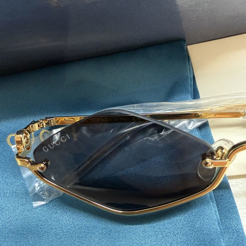 Gucci GG1604S 001 sunglasses, gold frame with black lenses