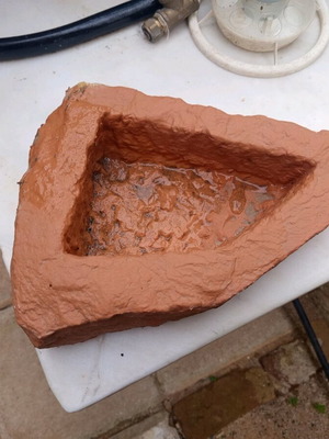 Stone waterer refurbished, carved stone