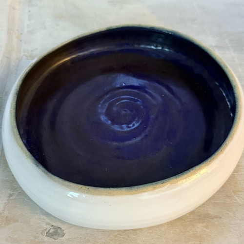 Handmade ceramic bowl new, white exterior and indigo interior