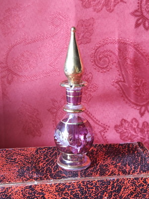 Vintage purple ruby glass perfume bottle with applicator
