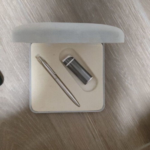 Gift set with lighters, pens, keychain, and calculator
