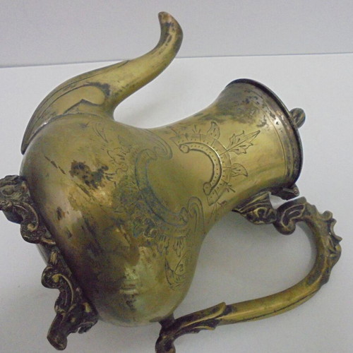 Old bronze teapot with decorative ornaments