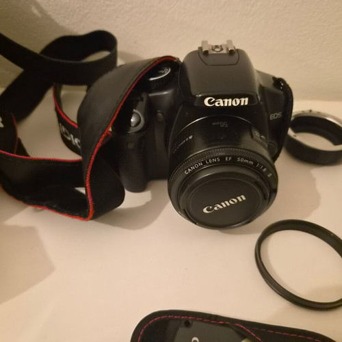 Canon EOS 450D camera used with 17-85mm zoom lens and accessories