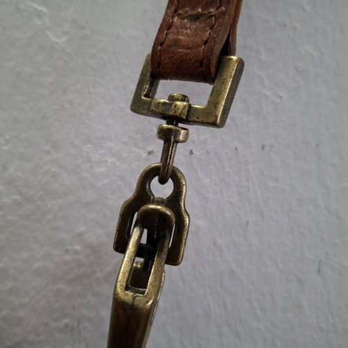 Vintage cowboy leather shoulder bag with metal accents like new