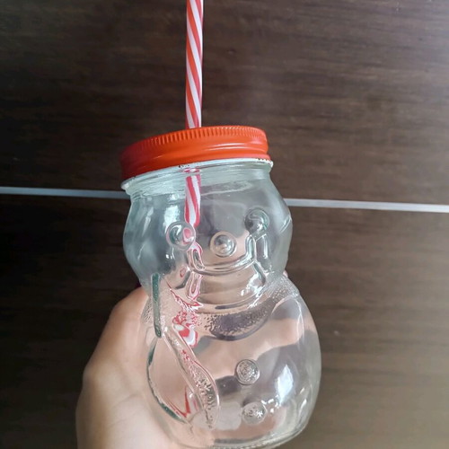 Glass Christmas cup used with straw