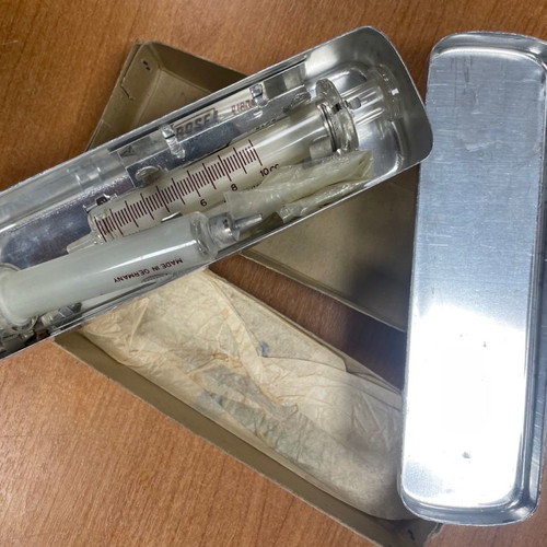 Glass syringes used from 1968 with metal case and accessories