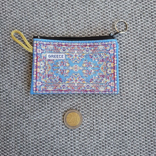 Wallet with traditional carpet pattern used, small and elegant
