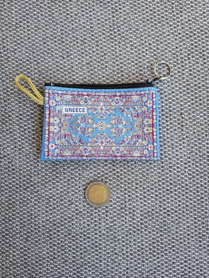Wallet with traditional carpet pattern used, small and elegant