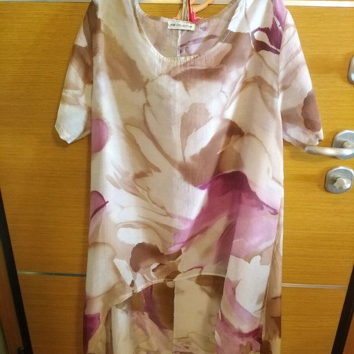 Floral blouse airy like new, longer at the back