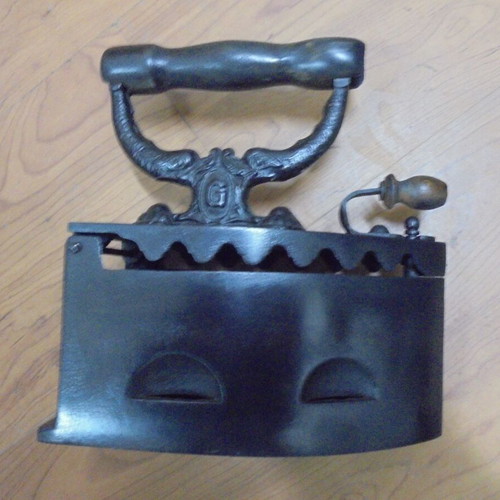 Antique charcoal iron restored with internal grill