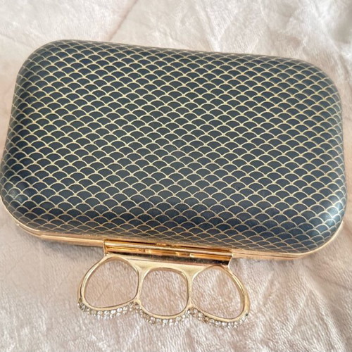 Evening bag like new with unique clasp and black-gold rhinestones