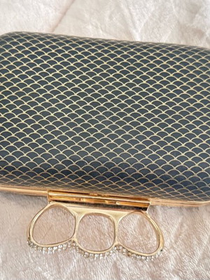 Evening bag like new with unique clasp and black-gold rhinestones