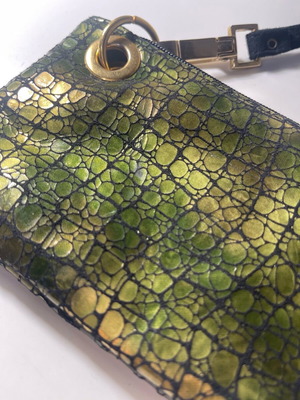 Vintage women's shoulder bag used with iridescent green croc pattern