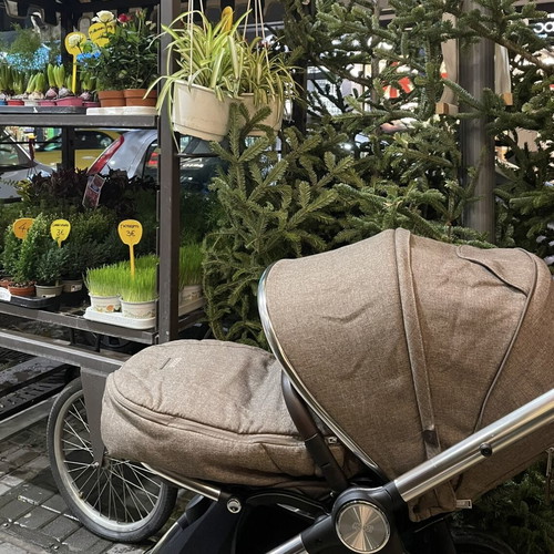 Ocarro Wallnut stroller used with car seat and accessories by Mamas & Pappas