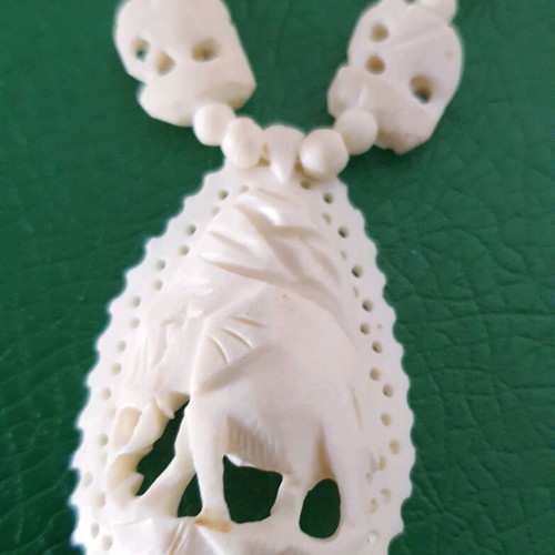 Carved vintage bone necklace with elephant pendant