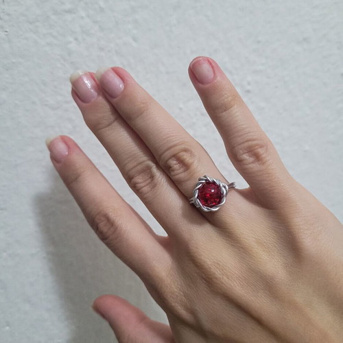 Fantasy wire ring like new with red crystal bead and silver wire