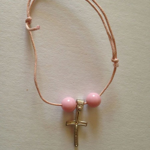 Pink bracelet used with silver cross and pink beads