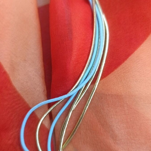 Metal necklace with turquoise and gold elastic cords